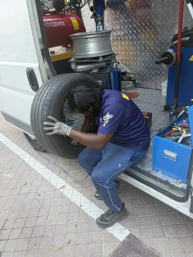 Technician working from a mobile tyre van in Dubai