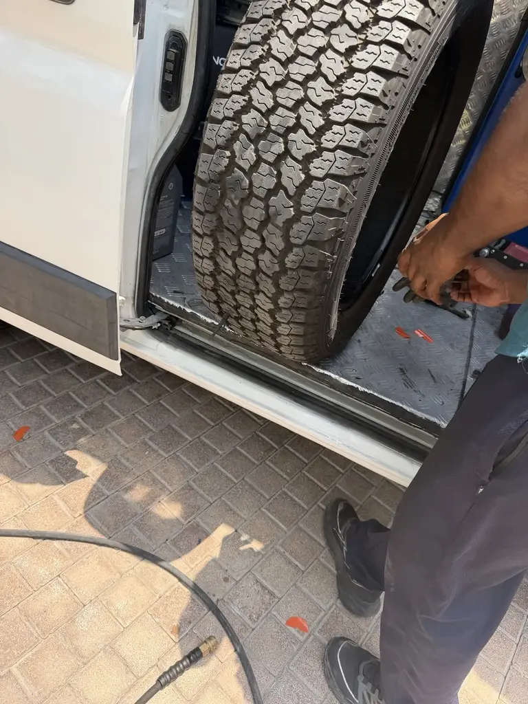 Mobile tyre fitting service at a Dubai parking location